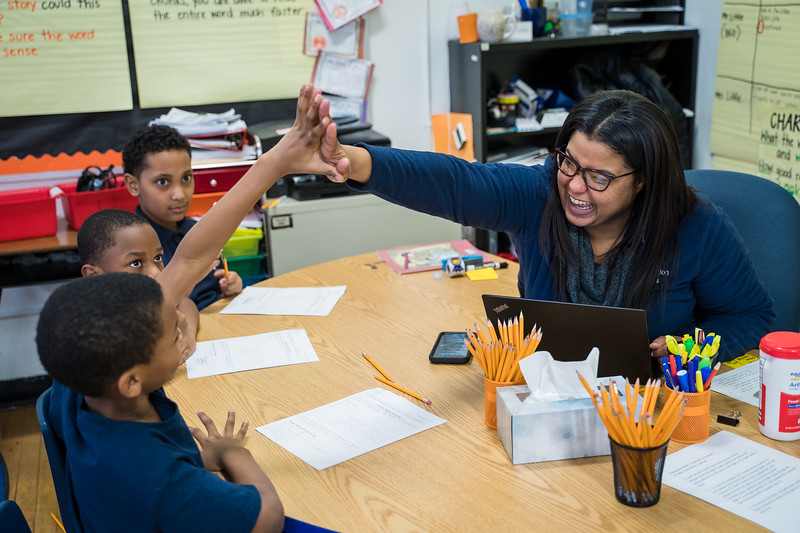 CICS Avalon teacher giving high five to her students in Chicago, Illinois